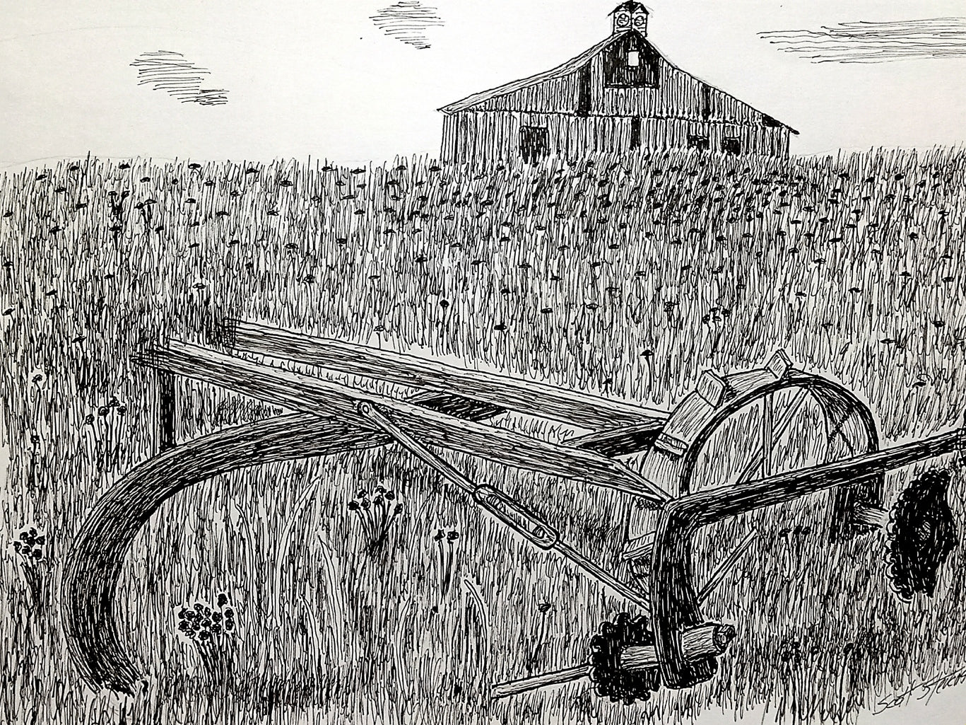 antique plow in overgrown field with an old barn in the backgound