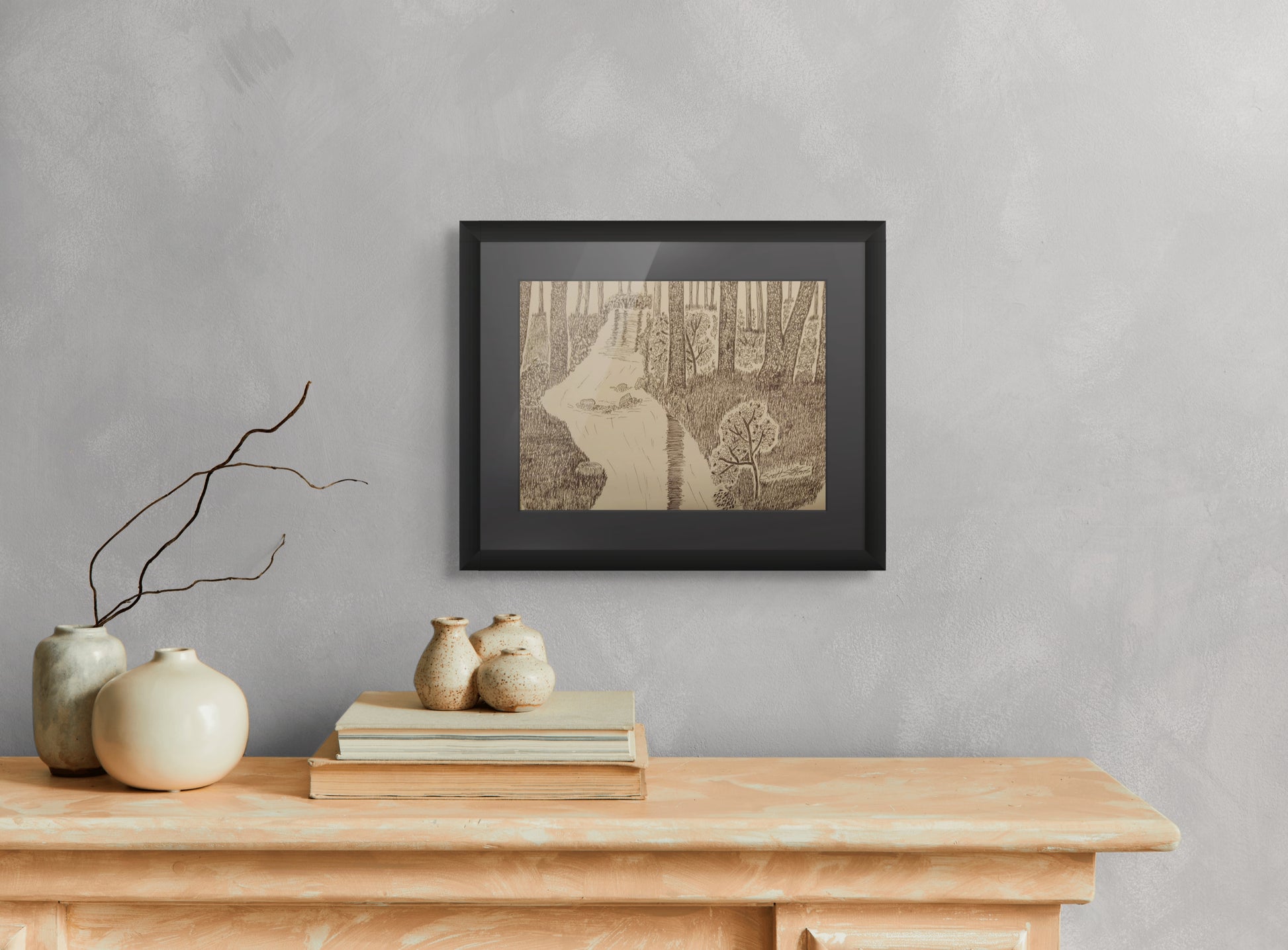 Framed pen and ink print of a serene wilderness scene.