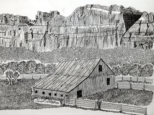 A black and white handcrafted art print featuring a pen and ink drawing of a farmhouse with a mountain range in the background.