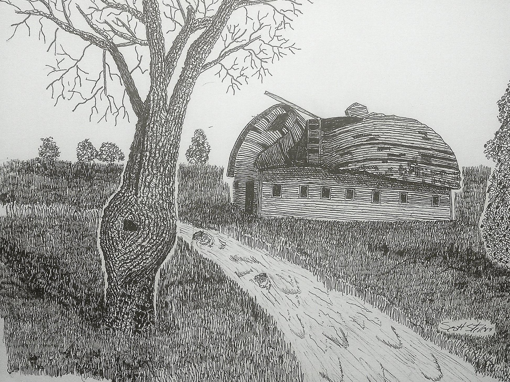 A black and white handcrafted pen and ink art print of an old barn with a tree and a stream in the foreground.