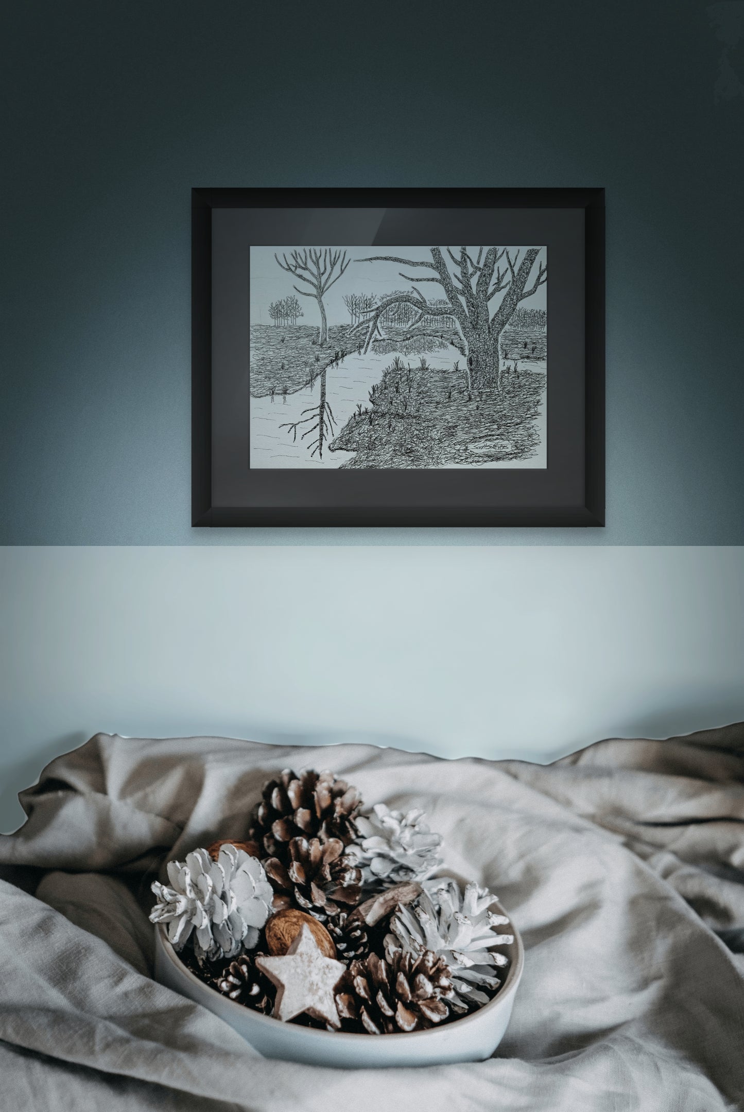 Framed pen and ink drawing of trees and reflective water on a wall.