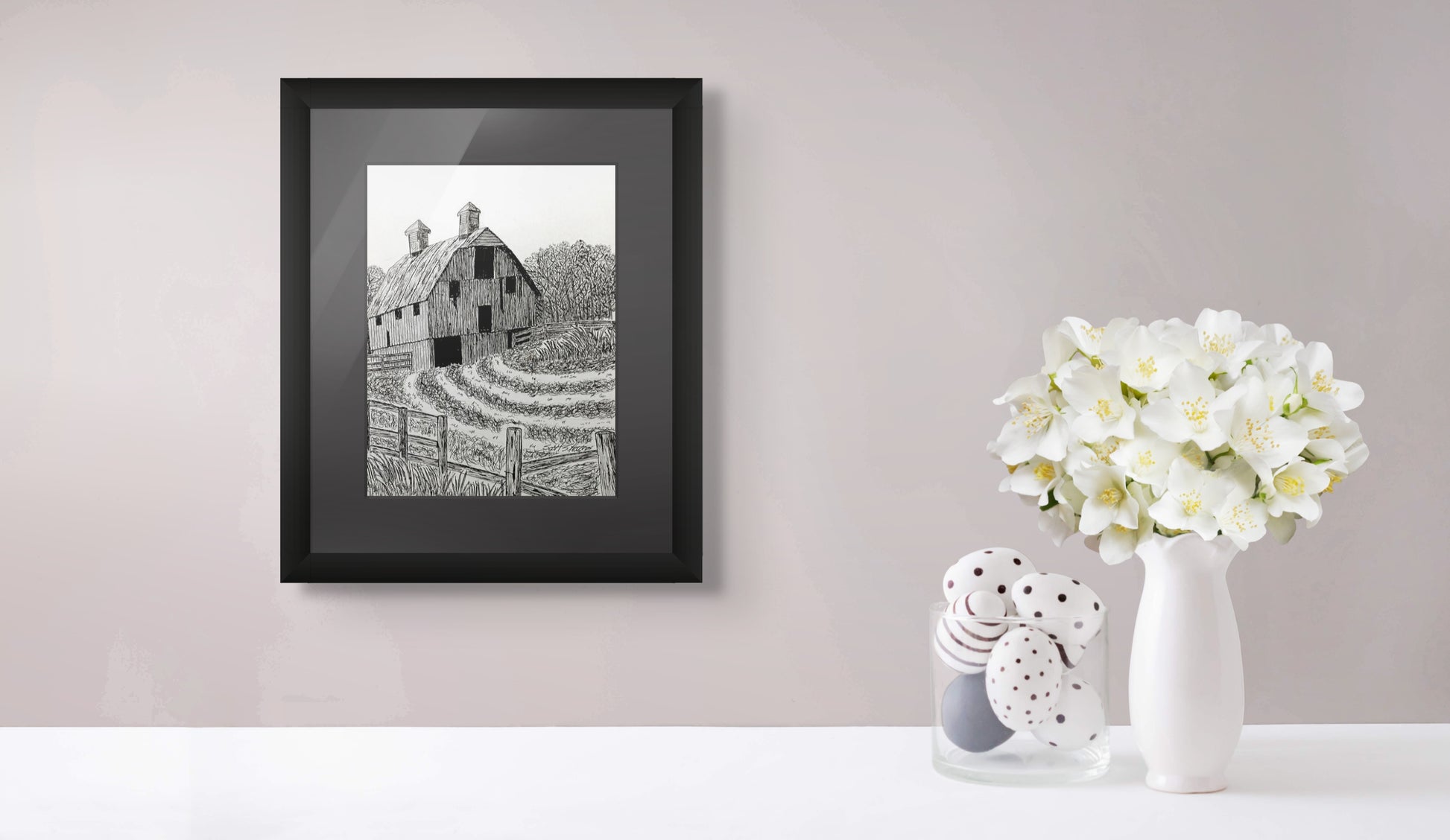 Framed version of the original drawing of an old barn in a cornfield with a fence in the foreground.