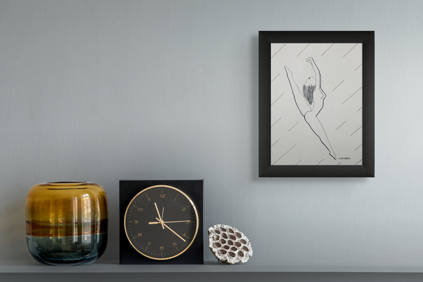 Framed drawing of a nude dancer, weightless and exalted, she arcs through the air with effortless assurance. Her body, stretched between opposing directions, captures the essence of freedom.