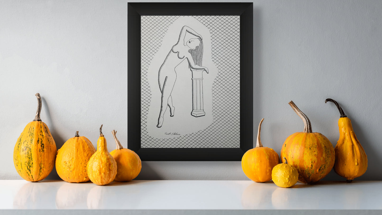 Framed artwork of a nude figure on a gray wall with pumpkins and gourds on a white surface.