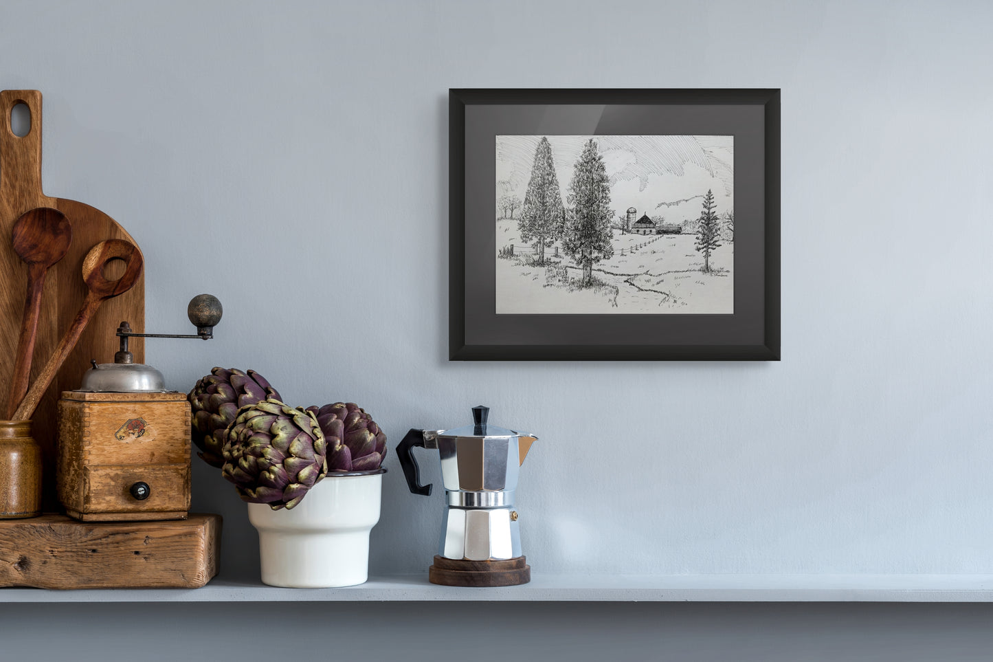 Framed print of a pen and ink drawing of pine trees next to a stream with a barn and silo.
