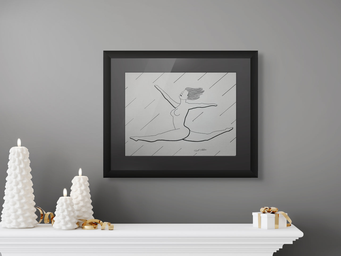 Framed black and white artwork of a dancer on a gray wall above a white mantelpiece with decorative items.
