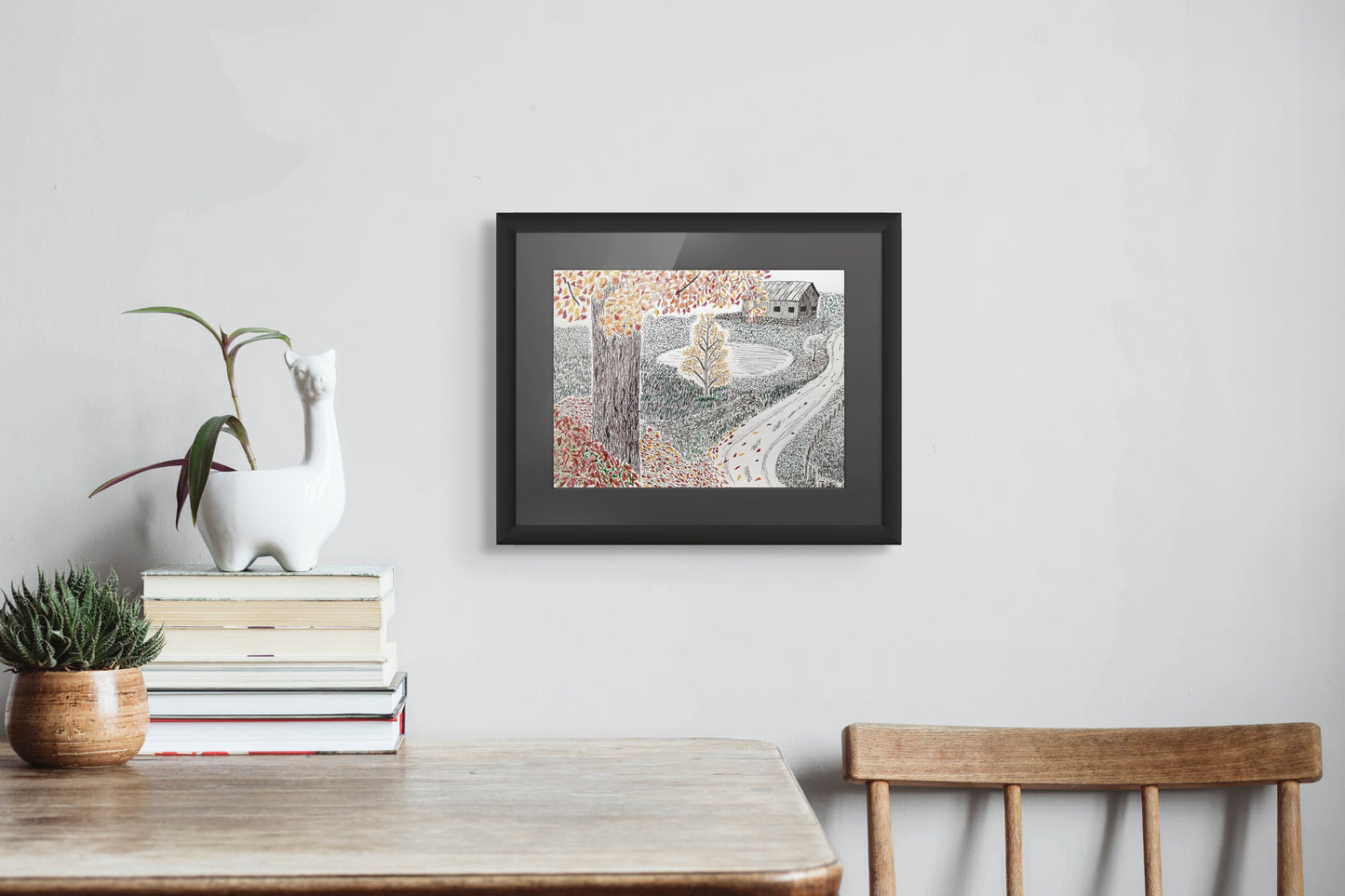 Framed drawing of an autumn scene with trees and a barn.